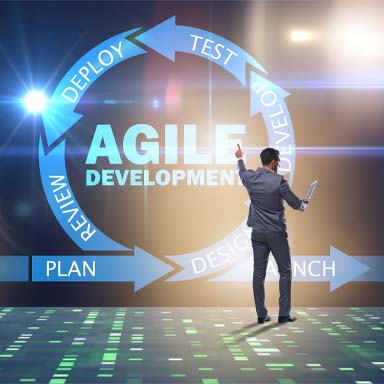 image of man in suit working on agile development